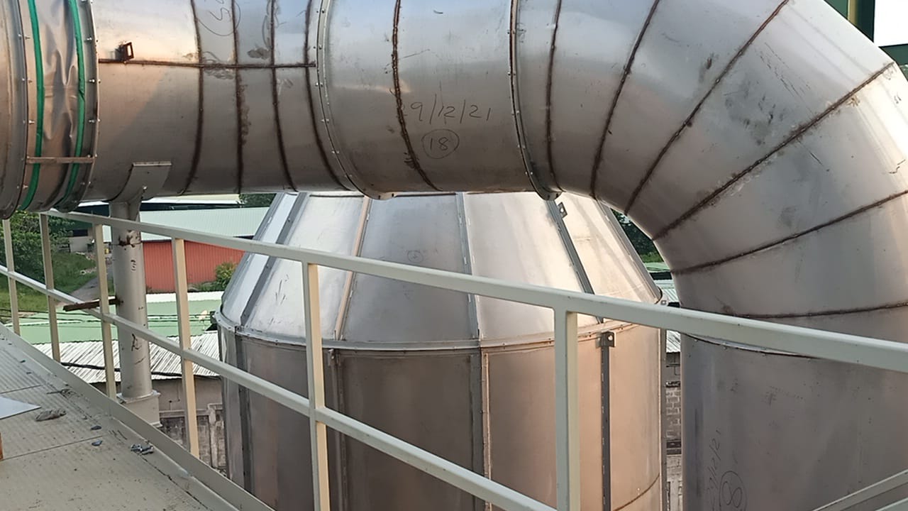 Two each of gray, white, and black shirts laying flat.